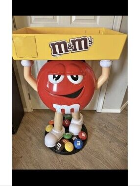 M&M'S Red Character Display with Yellow Tray and Multicolor Candy Base